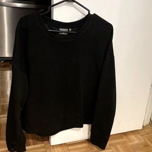 Black sweater with thumb holes.